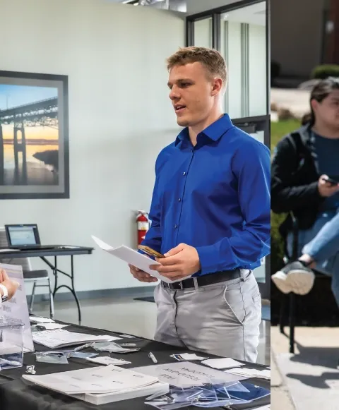 Man standing at booth at job fair.